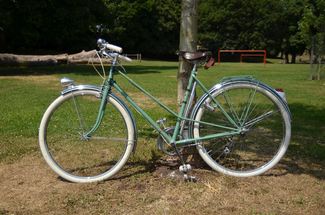 1950's Vintage Peugeot Bicycle Left Side Against a tree